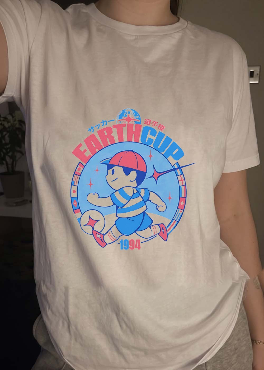 Earth Cup 1994 Soccer Tournament Ness Running With Ball Earth Cup T-Shirt