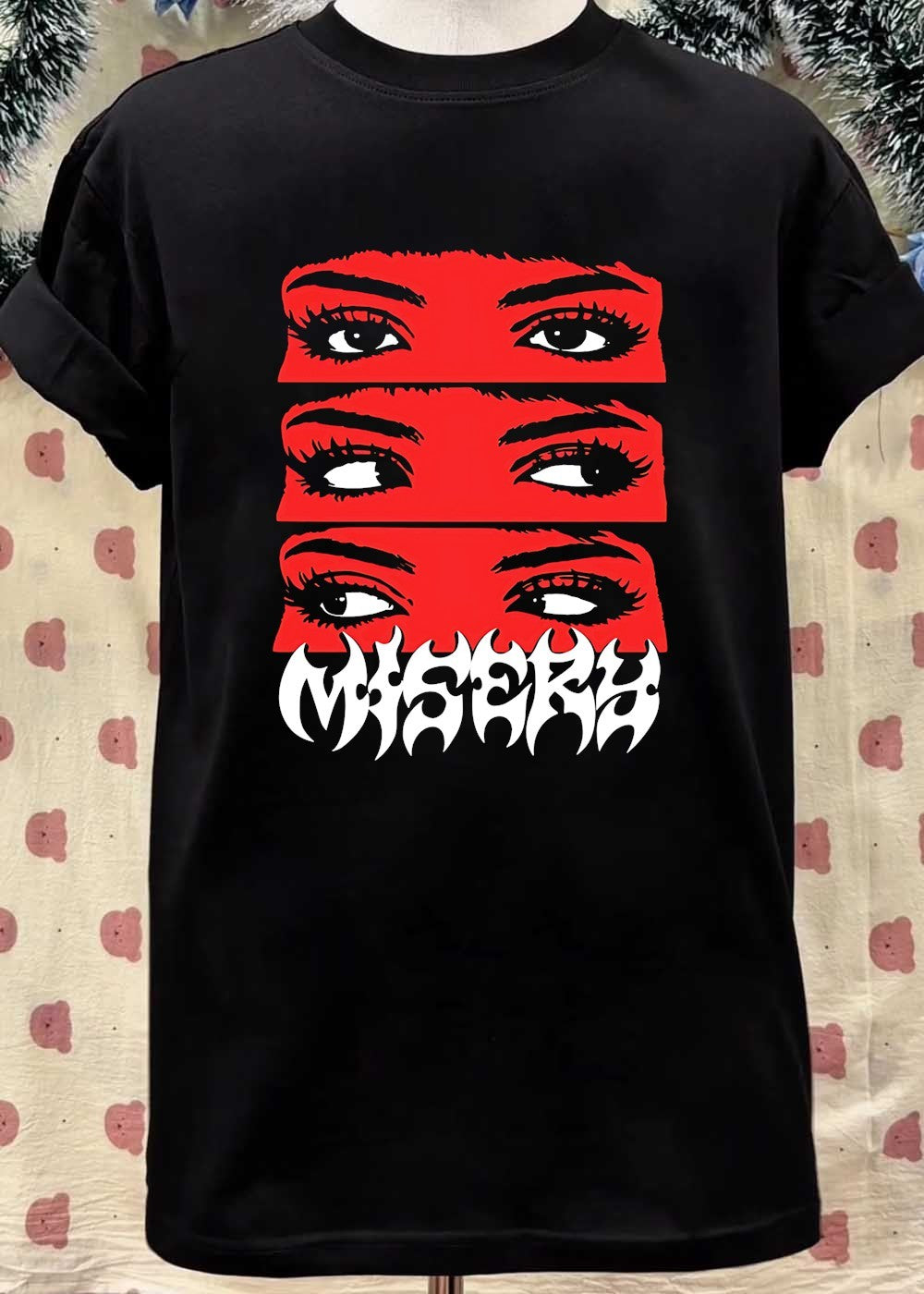 Is A Graphic Department Misery Eyes Glancing Graphic T-Shirt